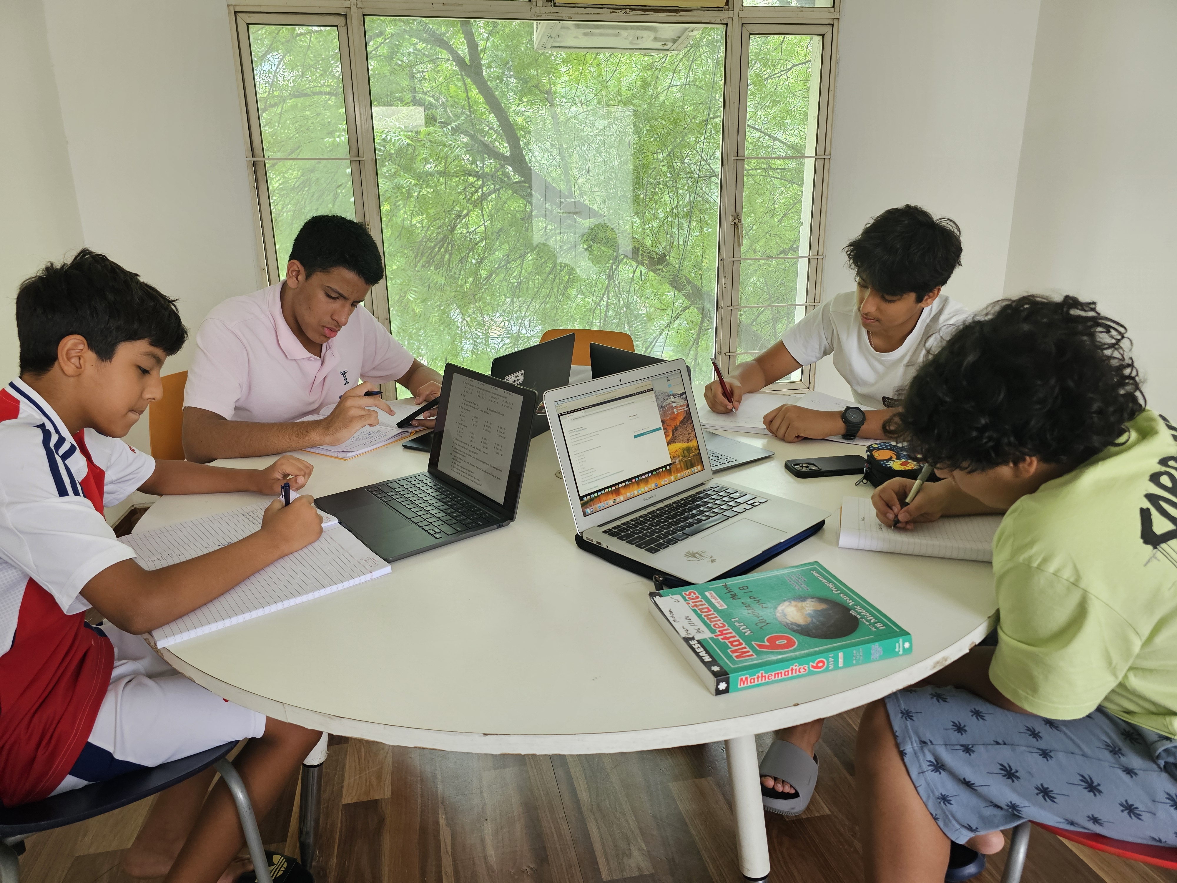 Students studying together at IB Mathience Academy